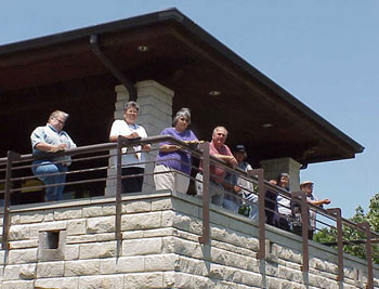 Members of the pond naming team look out from the Missouri Department of Conservation building on campus.